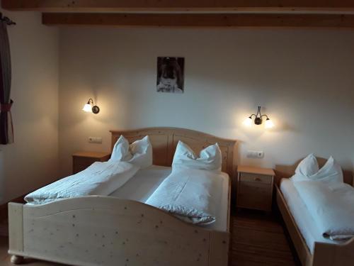 Giường trong phòng chung tại Pension Marchnerhof