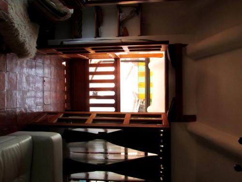 a window in a room with a table and a couch at Quinua Boutique Apartments in Cusco