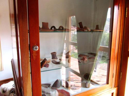 a glass display window with shoes on display at Quinua Boutique Apartments in Cusco