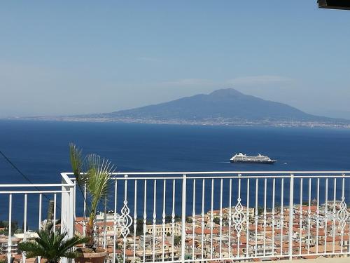 a cruise ship in the water near a city at MiraSorrento in Sorrento