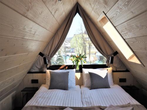 a bedroom with two beds in a tent at VIP APARTAMENTY VILLA GÓRSKIE KLIMATY in Zakopane