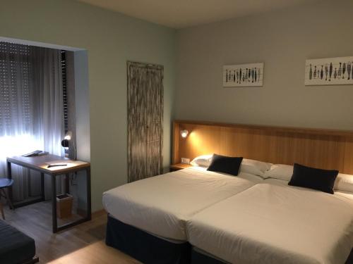 Posteľ alebo postele v izbe v ubytovaní Hotel Celanova