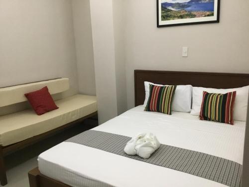 Кровать или кровати в номере 4.13 Suites Hotel