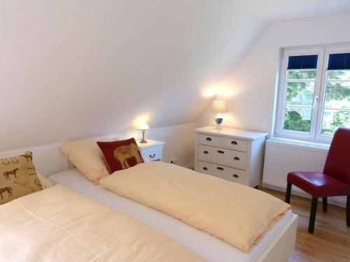 Postel nebo postele na pokoji v ubytování Ferienhaus *Koggenhüs*