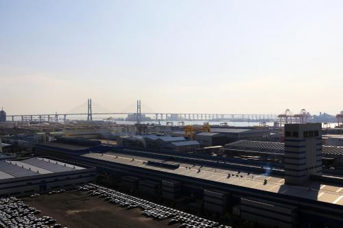 a view of a train station with a bridge in the background at EKklim Classic Hotel in Pyeongtaek