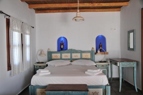 Ένα ή περισσότερα κρεβάτια σε δωμάτιο στο Παντέλι beach επιπλωμένα διαμερίσματα