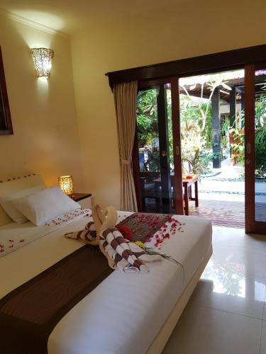 Postel nebo postele na pokoji v ubytování Senang Villa Gili Air
