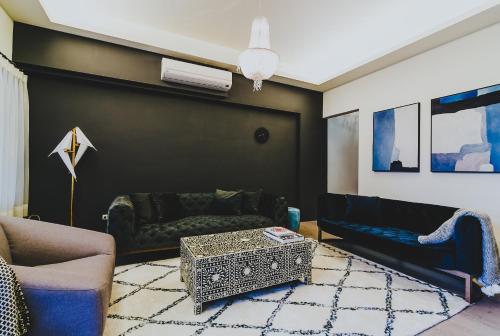 a living room with a couch and a table at Chloechen Home in Taitung City