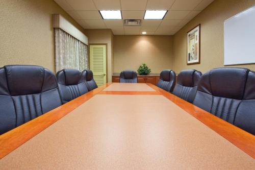 a conference room with a long table and chairs at Country Inn & Suites by Radisson, Hagerstown, MD in Hagerstown