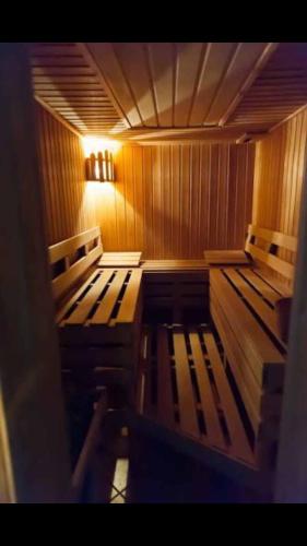 a room with wooden benches in a sauna at Casa Ardeleana in Predeal