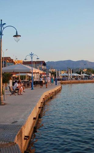 a pier next to a body of water at TETYK Keramoti Hotel Apartments in Keramotí