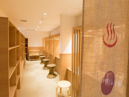 a row of toilets in a dressing room at Arima Onsen Motoyu Ryuusenkaku in Kobe