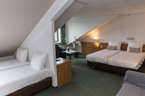 Postel nebo postele na pokoji v ubytování Fletcher Hotel Restaurant Heidehof