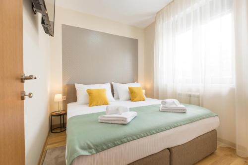 Postel nebo postele na pokoji v ubytování Prime Hotel Apartmani