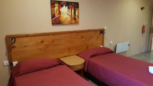 Кровать или кровати в номере Alborada Apart Hotel