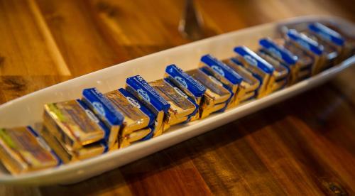 a tray of blue and gold chocolates on a table at Panoramagasthof auf dem Auerberg in Bernbeuren