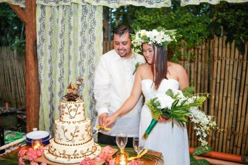 a bride and groom cutting their wedding cake at Natura Vista in Panglao