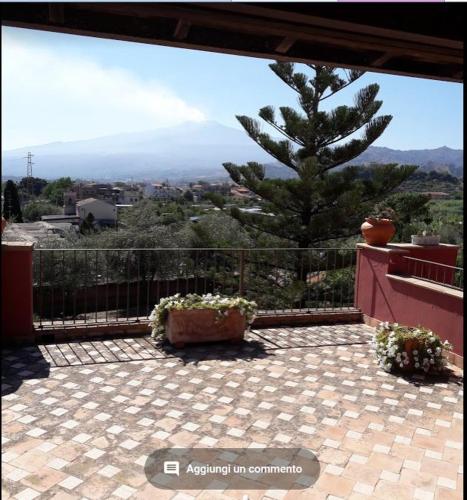a balcony with a view of a mountain at Villa Chiarenza Maison d'Hotes in Giardini Naxos