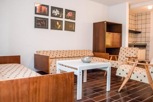 a room with a table and two chairs and a table at Apartment Ohrid Forever in Lagadin