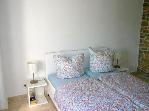a bedroom with a bed with two pillows on it at Villa Kentic in Buzet