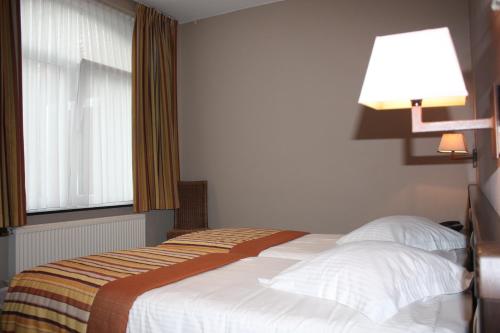 
Ein Bett oder Betten in einem Zimmer der Unterkunft Hotel Giorgi
