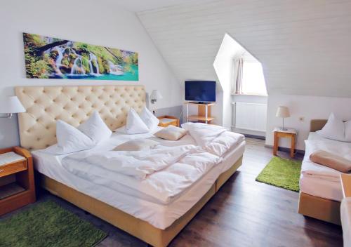 Postel nebo postele na pokoji v ubytování Hotel Kattenbeck
