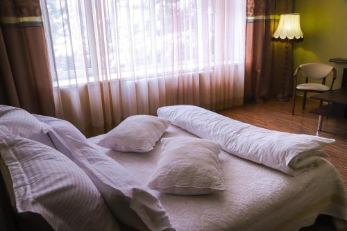 Кровать или кровати в номере Safari-Club