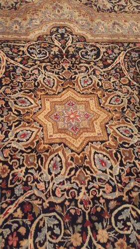 a close up of a rug with a design on it at Penzion-apartmán U Johana in Moravská Třebová