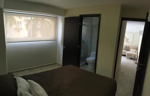 Ein Bett oder Betten in einem Zimmer der Unterkunft Departamento en Acapulco Diamante