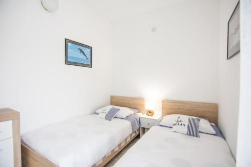 Tempat tidur dalam kamar di Apartment Sali Dugi Otok