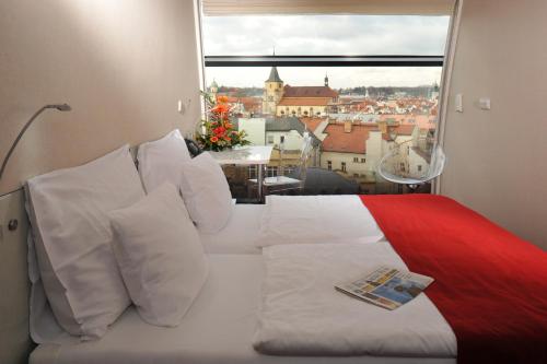 Vuode tai vuoteita majoituspaikassa Design Metropol Hotel Prague