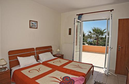 Ένα ή περισσότερα κρεβάτια σε δωμάτιο στο Elena-Pelagia Villas