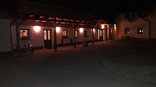 a group of buildings at night with lights at Ötscherblick Fam Winter in Frankenfels