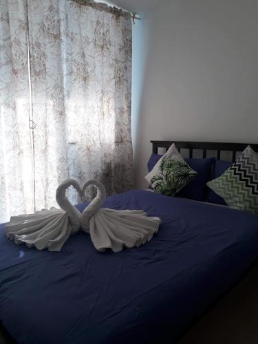 Postel nebo postele na pokoji v ubytování Joanne Sweet Home