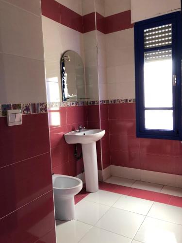 a bathroom with a sink and a toilet at El Muniria in Tangier