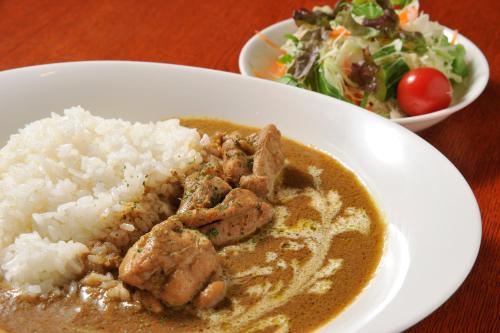 a plate of food with meat and rice and a salad at Matsumoto Tourist Hotel in Matsumoto