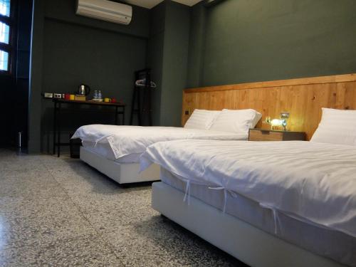 Ein Bett oder Betten in einem Zimmer der Unterkunft Xin Yuan Hang Homestay