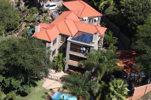 an overhead view of a house with an orange roof at Waterfalls Boutique Hotel in Pretoria