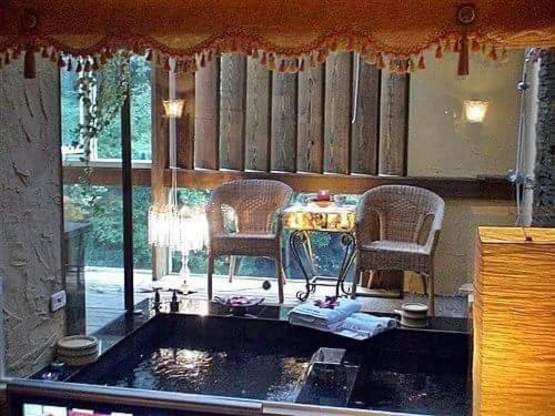 a room with a table and two chairs and a window at 51 Spring in Wulai