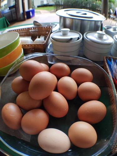 a bunch of eggs in a plate on a table at Arantarakiri Resort Khao Yai in Mu Si