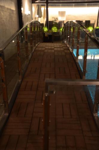 a walkway leading to the pool on a cruise ship at HOTEL dGATES in Lahore
