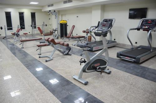 a gym with a bunch of exercise bikes and treadms at HOTEL dGATES in Lahore