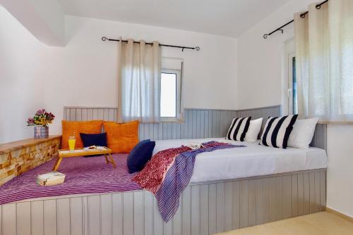 Postel nebo postele na pokoji v ubytování Summer Breeze Villa