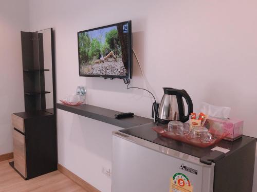 Un televizor și/sau centru de divertisment la Living at Sphere Apartment