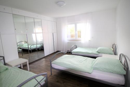 Ένα ή περισσότερα κρεβάτια σε δωμάτιο στο Work & Stay Sankt Augustin