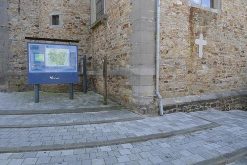 a sign on the side of a brick building at Beautiful and Spacious Contemporary house in Oignies-en-Thierache