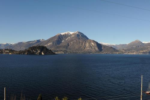 a large body of water with mountains in the background at New Attic Lake View 4 in Varenna