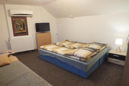 מיטה או מיטות בחדר ב-Pod Bastionem