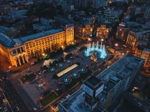 an aerial view of a city at night at Senator Maidan in Kyiv