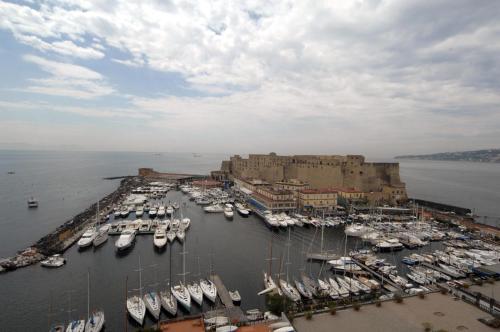 an aerial view of a harbor with boats in the water at Transatlantico in Naples